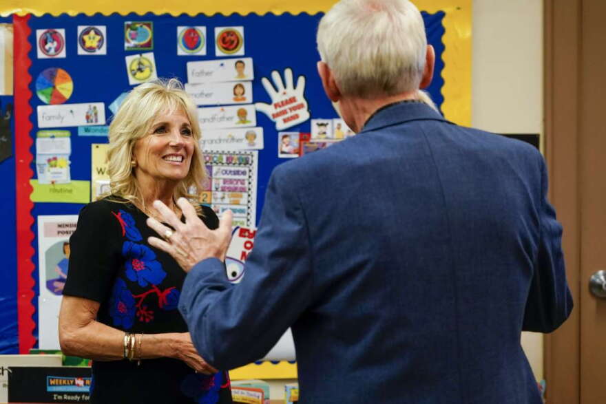 First lady Jill Biden and Wisconsin Gov. Tony Evers talk during a stop at Westside Academy Wednesday, Oct. 12, 2022, in Milwaukee. (AP Photo/Morry Gash)