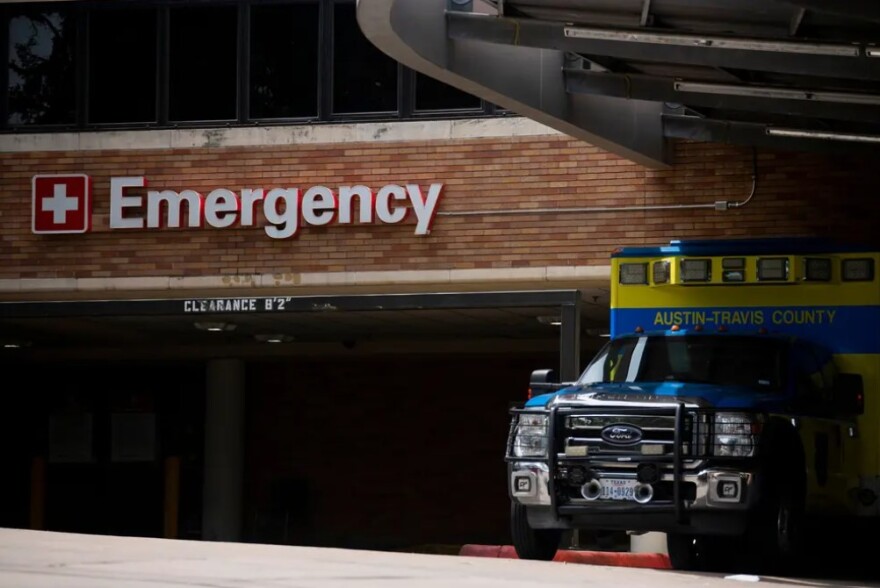  An Austin-Travis County EMS unit parked near a hospital's emergency entrance in Austin on July 7, 2020.