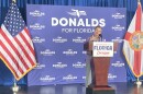 Man speaking at a podium