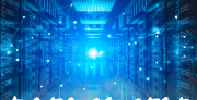 Server racks bathed in blue light with the words "Data Center Dilemma"
