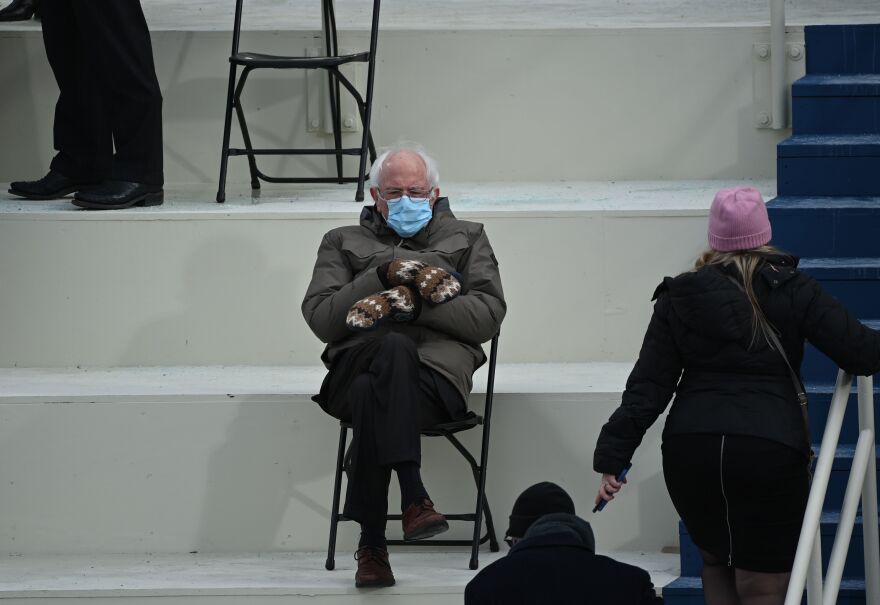 Sen. Bernie Sanders (I-Vt.), a former presidential candidate, looks toasty in the bleachers on Capitol Hill before Joe Biden is sworn in as the 46th president.