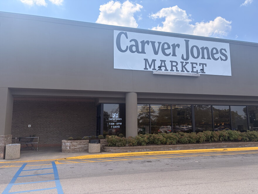The front facade of the Carver Jones Market. A banner hanging above the front windows reads "Carver Jones Market."