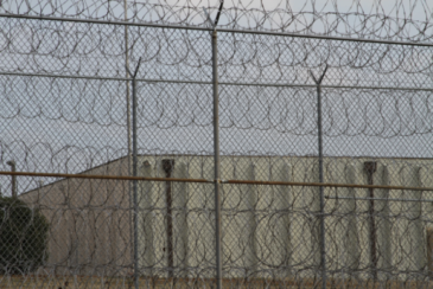 A razor wire fence surrounds the Joseph A. Harp Correctional Center in Lexington.