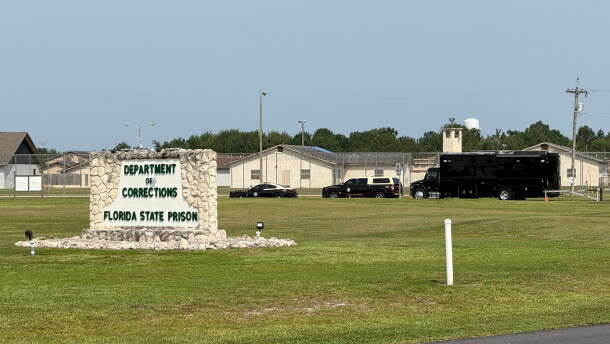 FILE - Law enforcement vehicles sit parked outside the Florida state prison in Starke, Fla., on Tuesday, July 28, 2026. (AP Photo/David Fischer, file)