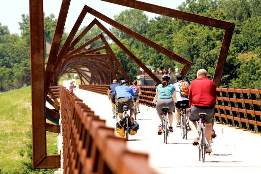 Cyclists ride across the High Trestle Trail bridge near Madrid, Iowa.