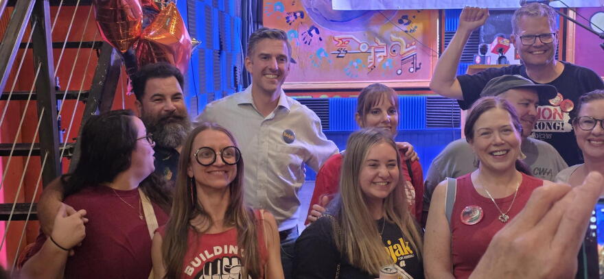 Adam Bojak (middle) celebrates with supporters at his primary night viewing party on Buffalo's West Side following his victory in the 149th Assembly District Democratic primary.