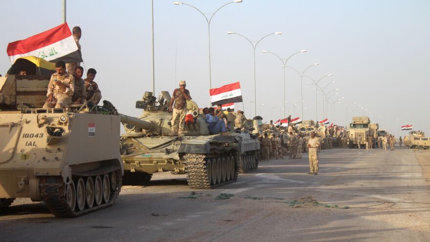 Iraqi government forces are seen near the Falahat village west of Fallujah on June 27. Iraqi forces retook the city of Fallujah from the Islamic State.