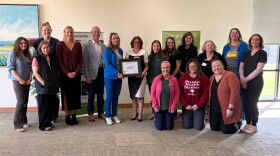 Pine Rest Christian Mental Health Services pose with accreditation certificate.