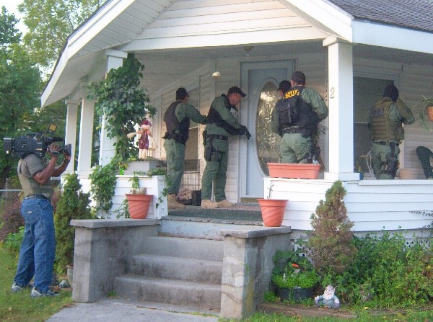 Agents raid a home in Miami.