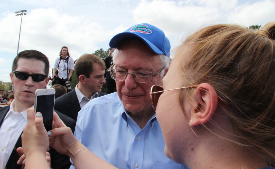 Sen. Bernie Sanders takes a photo with a supporter Thursday at the University of Florida. (Kaila Jones/WUFT News)