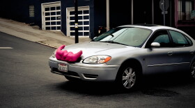 Lyft cars are easily recognizable because of the pink mustaches on the front of their hoods. (Photo courtesy Spiros Vathis/Flickr)