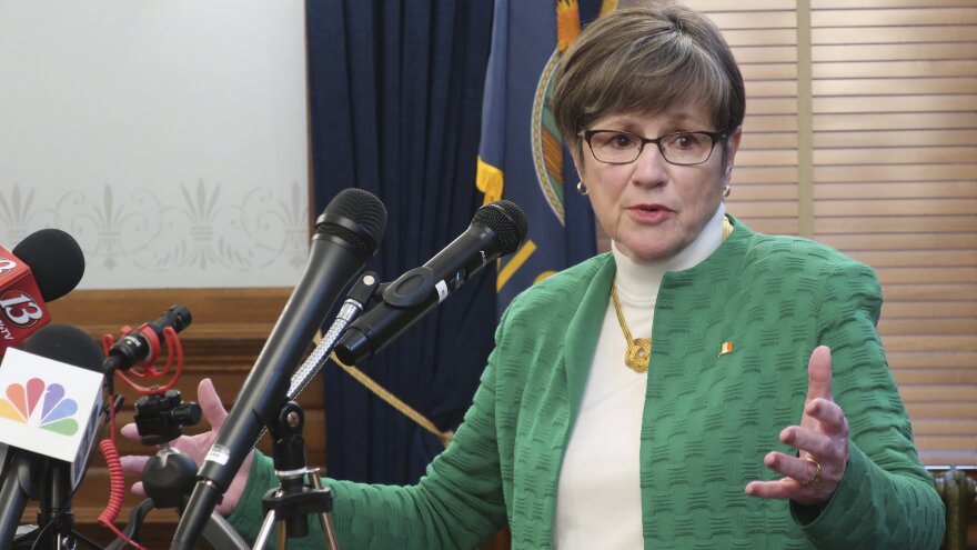 Kansas Gov. Laura Kelly addresses a news conference Tuesday in Topeka, Kan., after announcing the closure of K-12 schools throughout the state for the rest of the school year.