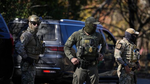 U.S. Border Patrol agents look on, Monday, Nov. 17, 2025, in Charlotte, N.C. (AP Photo/Matt Kelley)