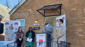 Greater Cincinnati Realtist Association President Darrick Dansby speaks in front of a home The Port purchased from an out-of-town landlord in 2022.