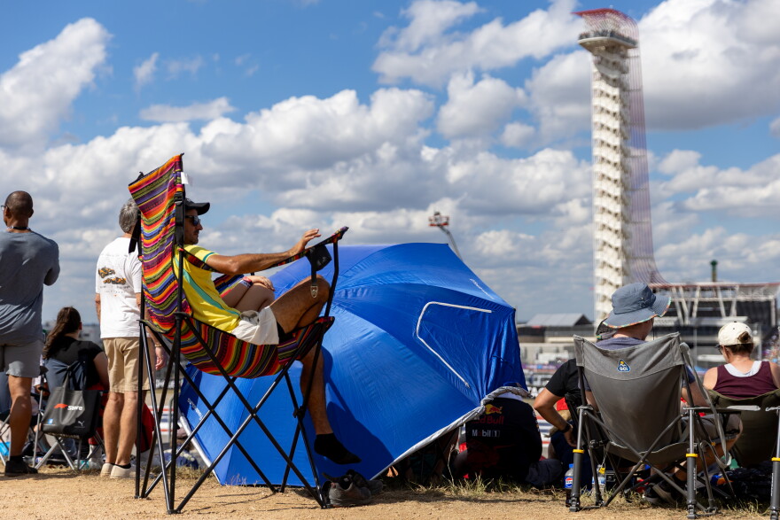 Tiago da Silva watches the third practice session from a giant lawn chair at the United States Grand Prix.