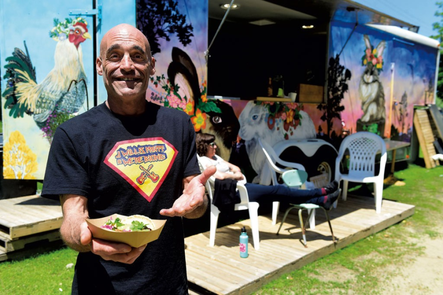 Adam Woogmaster lets customers choose what they pay for his tacos at Chez Mami's food truck in Marshfield.