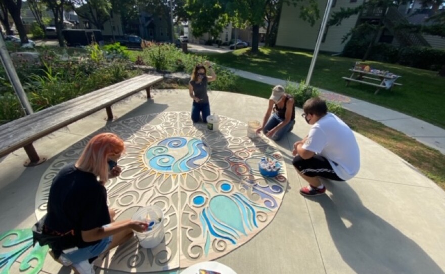 August 2020, Arts @ Large high school interns and neighbors helped with artist Marina Lee's mandala design at Paliafito Park.