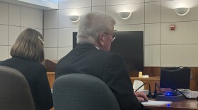 Michael Paschall, 63, at right, sits next to his attorney, public defender Hannah Marx, during his sentencing hearing July 9, 2026, in Fairbanks, Alaska. Paschall pleaded guilty in January to one count of felony scheme to defraud for stealing money from the Rural Deltana Volunteer Fire Department while he was serving as chief.