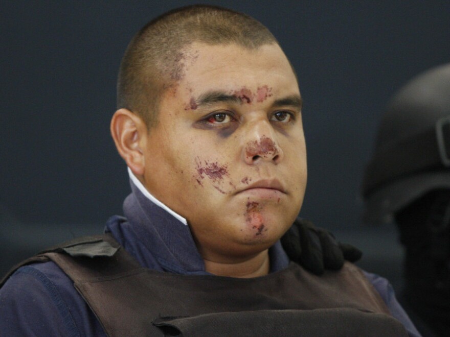 Jaime Francisco Leyva Merlos, aka "El Bebe" at the federal police headquarters in Mexico City on Wednesday.  According to the federal police, Leyva Merlos is a member of a group known as 'Los Caballeros Templarios.' He and seven other alleged members were arrested by federal police on June 21.