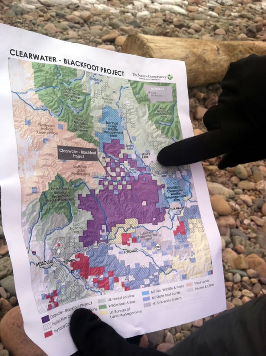 A Nature Conservancy representative points out portions of the land that make up the Clearwater-Blackfoot Project in the Blackfoot Valley. January 2015.