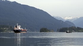 This May 3, 2018 photo shows the Kirkeholmen oil tanker anchored outside the Kinder Morgan Inc. Westridge oil terminal in Vancouver, Canada, at the end of the Trans Mountain pipeline that begins in northern Alberta.