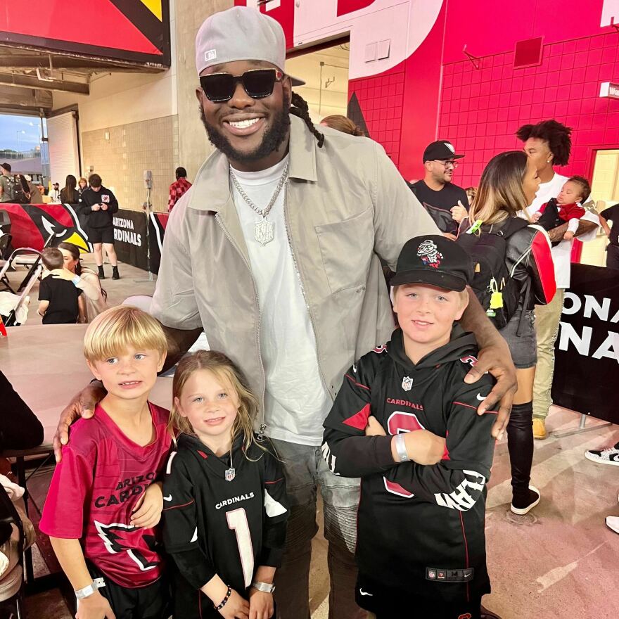 The Phillips family with their new favorite player, Jesse Luketa.