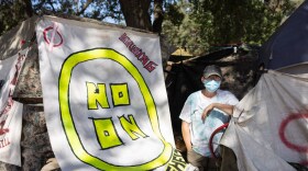 Sharon Jones by her tent along the American River watershed, Monday, Aug. 15, 2022.