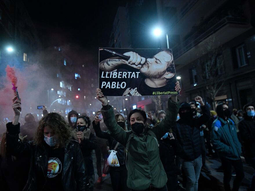 Protesters march with a picture of Spanish rapper Pablo Hasél reading "Freedom to Pablo" during a demonstration in Barcelona against his arrest on Feb. 16.