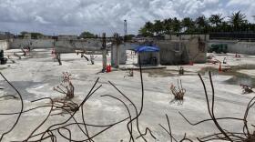 The site where the Champlain Towers South collapsed killing 98 people is shown on April 14, 2022, in Surfside, Fla. A judge has given final approval Thursday, June 23, 2022, to a settlement of more than $1 billion for victims of the collapse of a Florida beachfront condominium. Ninety-eight people died when the 12-story Champlain Towers South suddenly collapsed. The decision comes one day before the one-year anniversary of the disaster in the Miami suburb of Surfside.