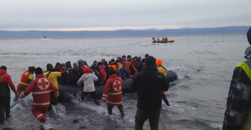 Migrants from Afghanistan arrive on a rocky beach in northern Lesbos, assisted by Greek Red Cross volunteers, Spanish lifeguards and other international volunteers.