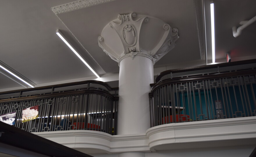 Along the mezzanine, you can see the original mahogany railing from the building's department store days.