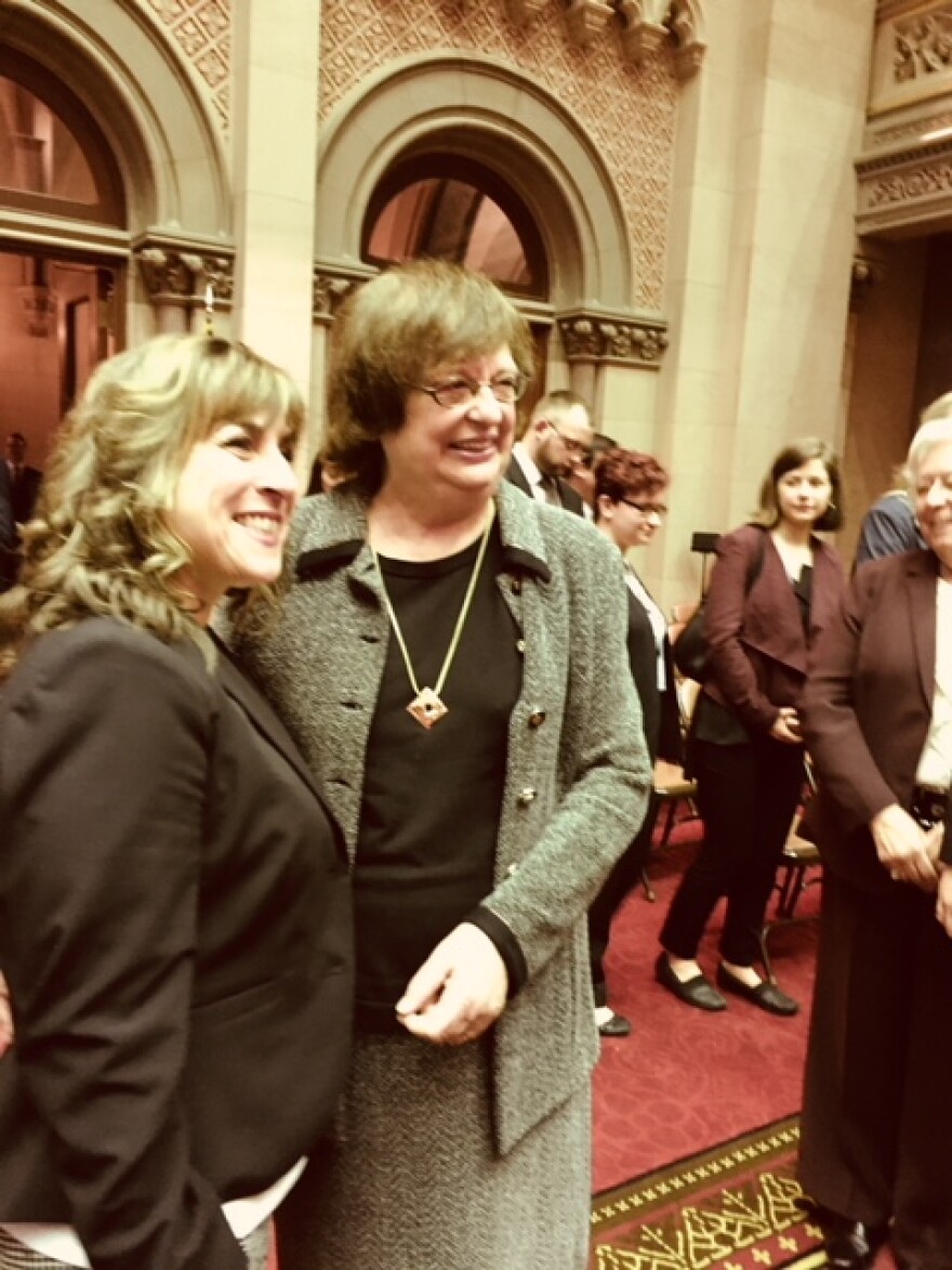 NY Attorney General Bararba Underwood posing with state Assemblywoman Christine Pelligrino as lawmakers lined up to get their picture taken with Underwood.