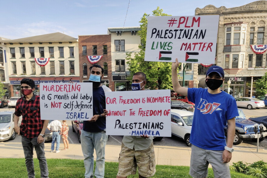 The Bloomington demonstration was one of dozens around the world Saturday expressing solidarity with Palestinians.