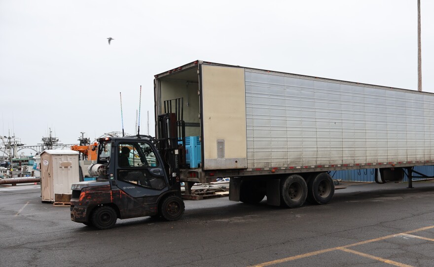 A forklift loads freshly-caught Dungeness crab into a refrigerated tractor-trailer on the pier in Newport on Jan. 27, 2026. It's first leg of a journey that will end in China for this load of crab, a delicacy coveted around the globe.