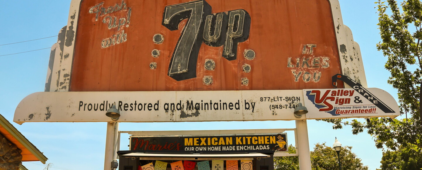 The 7UP billboard in Merced sits on Main Street next to the restaurant Maria’s Mexican Kitchen.