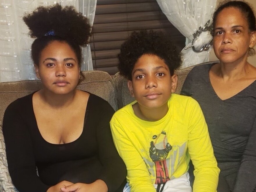 Quilcia Moronta (right), who was laid off from the Omni Providence Hotel last spring, with her children, Gabriela and Gabriel.