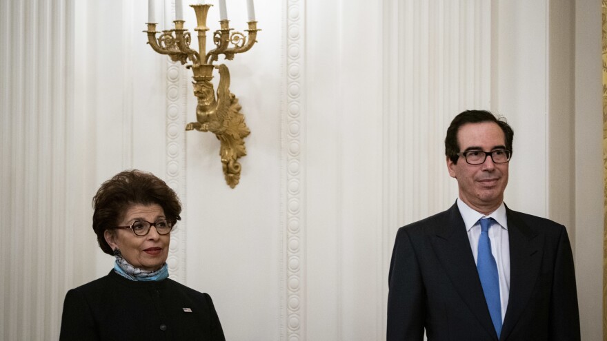 Jovita Carranza, head of the U.S. Small Business Administration, and Treasury Secretary Steven Mnuchin attend a Paycheck Protection Program event at the White House on Tuesday.