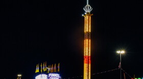 Funnel cake stand next to a ride at the West Texas Fair. Photo by Alexander Brown.
