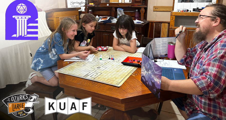 Evan McDonald, founder of Ozark Dice & Destiny, guides a group of campers through a dungeon.