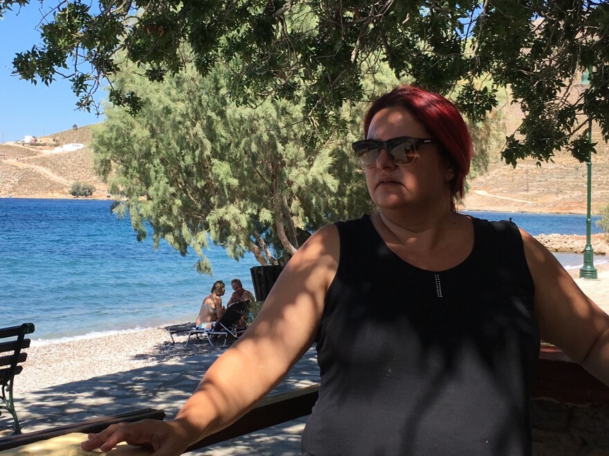 Tilos Mayor Maria Kamma sits outside a seaside cafe. "We wanted to evolve from simply a green island into a clean-energy island," she says. "We wanted to do something substantive."