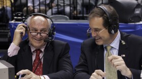 FILE - CBS announcers Billy Packer, left, and Jim Nantz laugh during a break in the championship game in the Big Ten basketball tournament in Indianapolis, March 12, 2006. Packer, an Emmy award-winning college basketball broadcaster who covered 34 Final Fours for NBC and CBS, died Thursday night, Jan. 26, 2023.