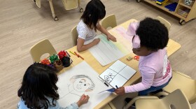 Children drawing after school inside one of the classrooms at the Children's Promise Centers child care center in Albuquerque, N.M., April 5, 2024. (AP Photo/Susan Montoya Bryan)