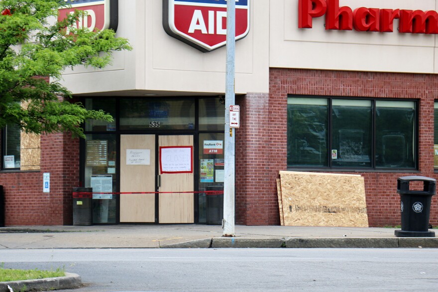 The Rite Aid on Portland Avenue in Rochester was boarded up Wednesday. The company said vandalism after peaceful Black Lives Matter protests over the weekend forced it to close some pharmacies.