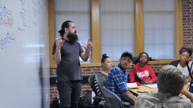 Instructor Mike Pagano works with participants of Continuity's film-training program on interview techniques.