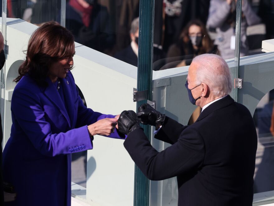 Vice President Harris celebrates with the incoming president after being sworn in Wednesday on the West Front of the U.S. Capitol.