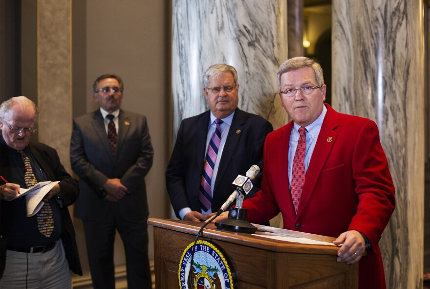 Sen. David Pearce answers questions from reporters on the last day of the legislative session. 