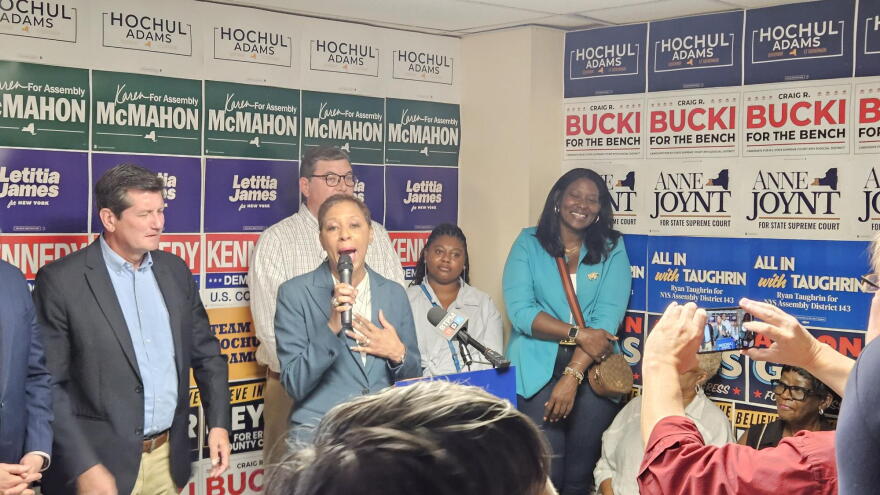 Adrienne Hill, with microphone, talks about being convinced by Governor Kathy Hochul to come out of retirement and become Hochul's partner in the gubernatorial race.