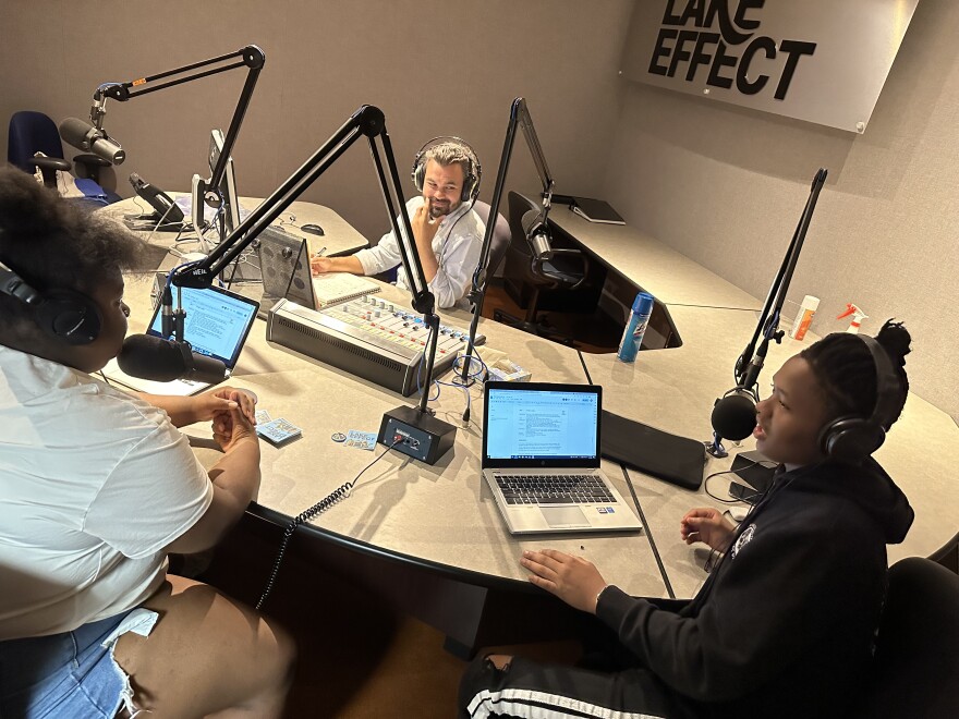 Three people in a radio studio