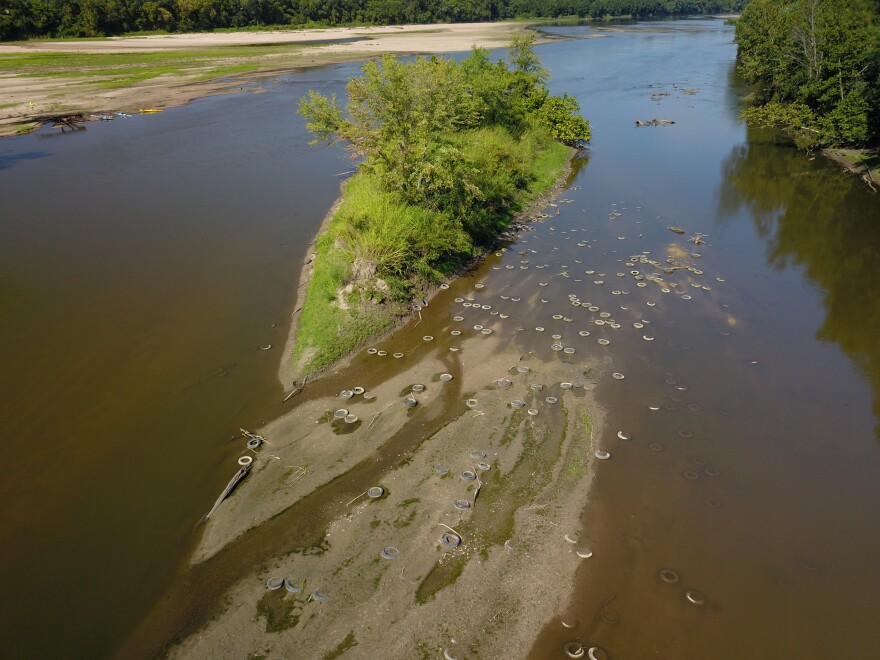 Tires dot the Kansas River between Eudora and De Soto. Volunteers removed them in October.