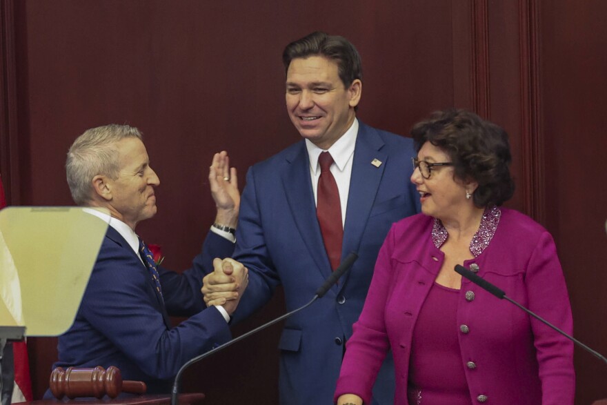 Florida Gov. Ron DeSantis is welcomed to a joint session of the Senate and House of Representatives by House Speaker Paul Renner, R-Palm Coast, left, and Florida Senate President Kathleen Passidomo, R-Naples, right, to give his State of the State address, Tallahassee, Fla., Tuesday, Jan. 9, 2024. 